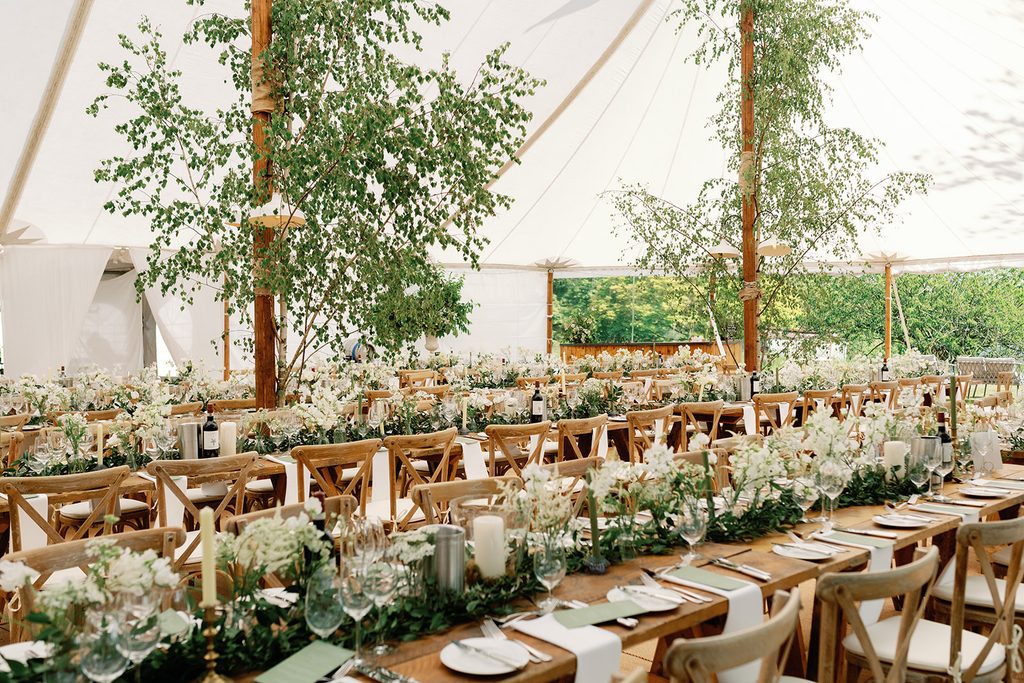 Sailcloth Tent Wedding with rustic tables and cross back chairs